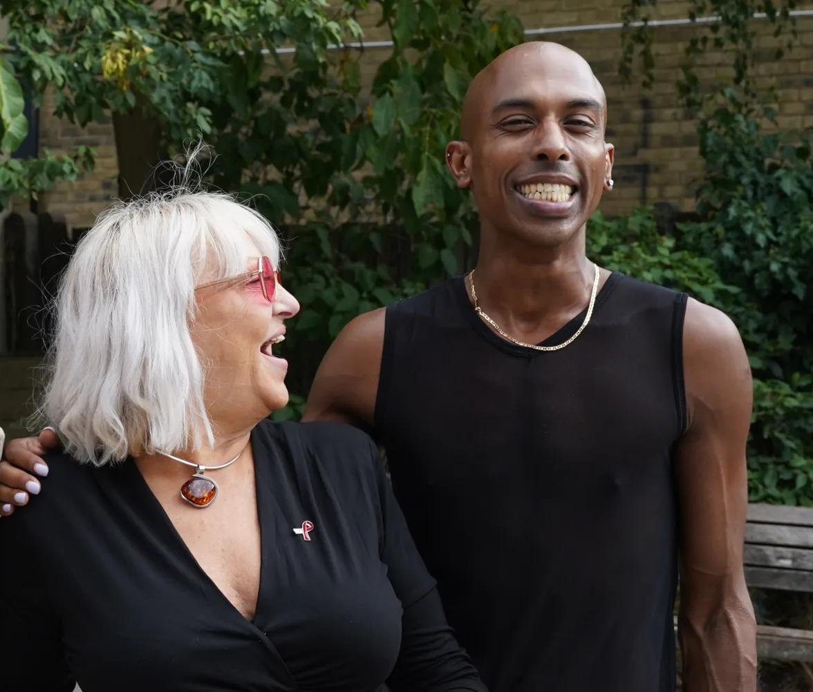 Two members of the HIV community laughing together